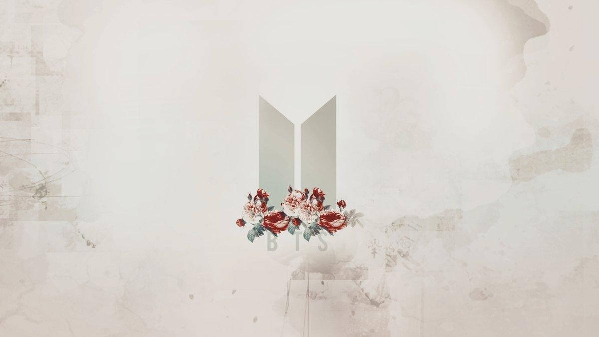 BTS लोगो फूलों के साथ लैपटॉप वॉलपेपर