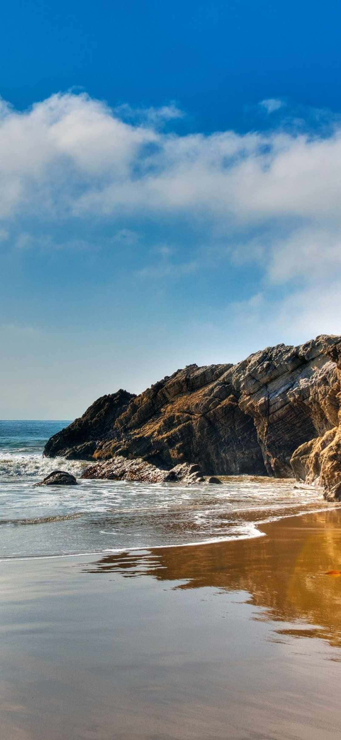 अपने iPhone Xs Malibu के साथ एक खूबसूरत समुद्र दृश्य का आनंद लें वॉलपेपर