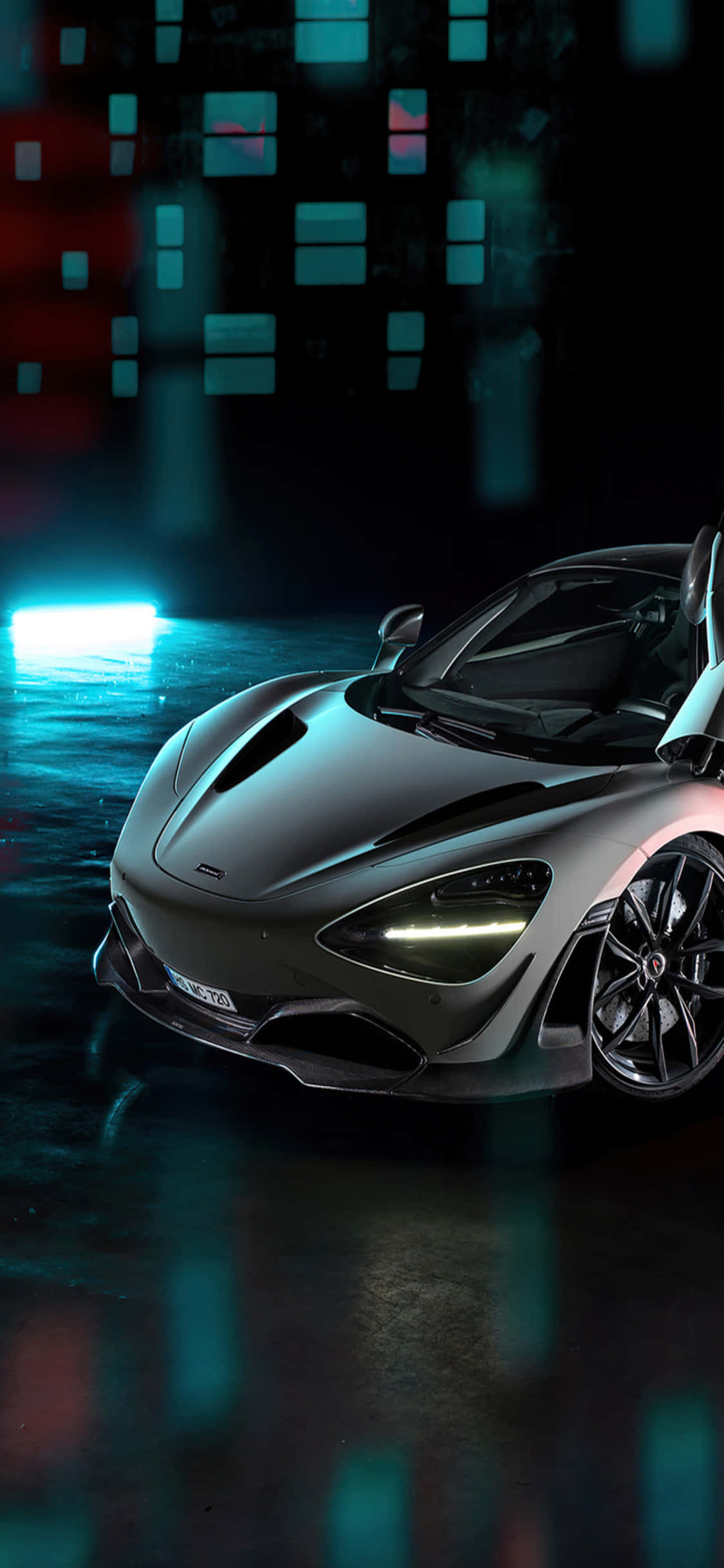 Sleek iPhone X with McLaren 720s Car Background वॉलपेपर