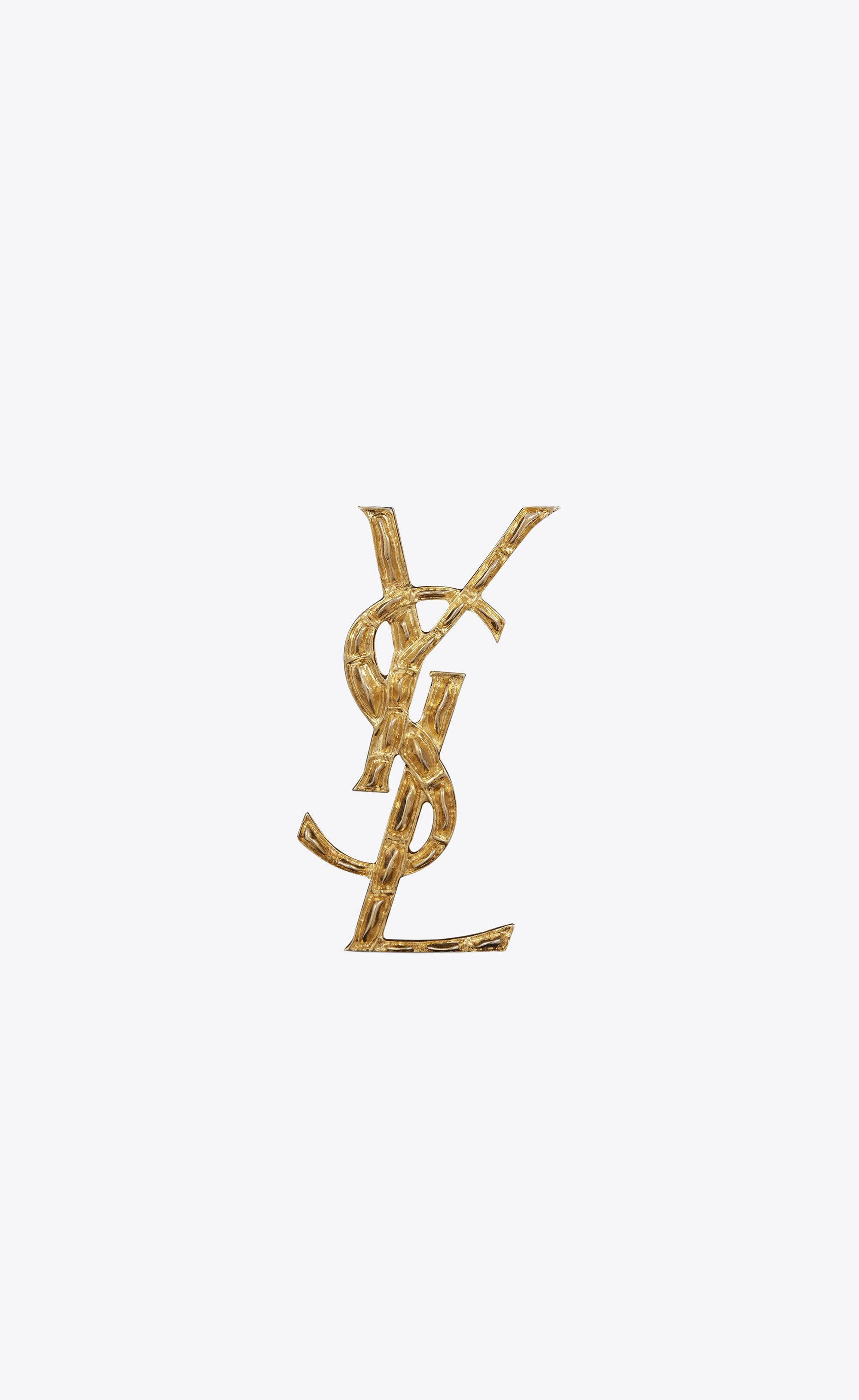 सोने का मगरमच्छ YSL ब्रोच वॉलपेपर