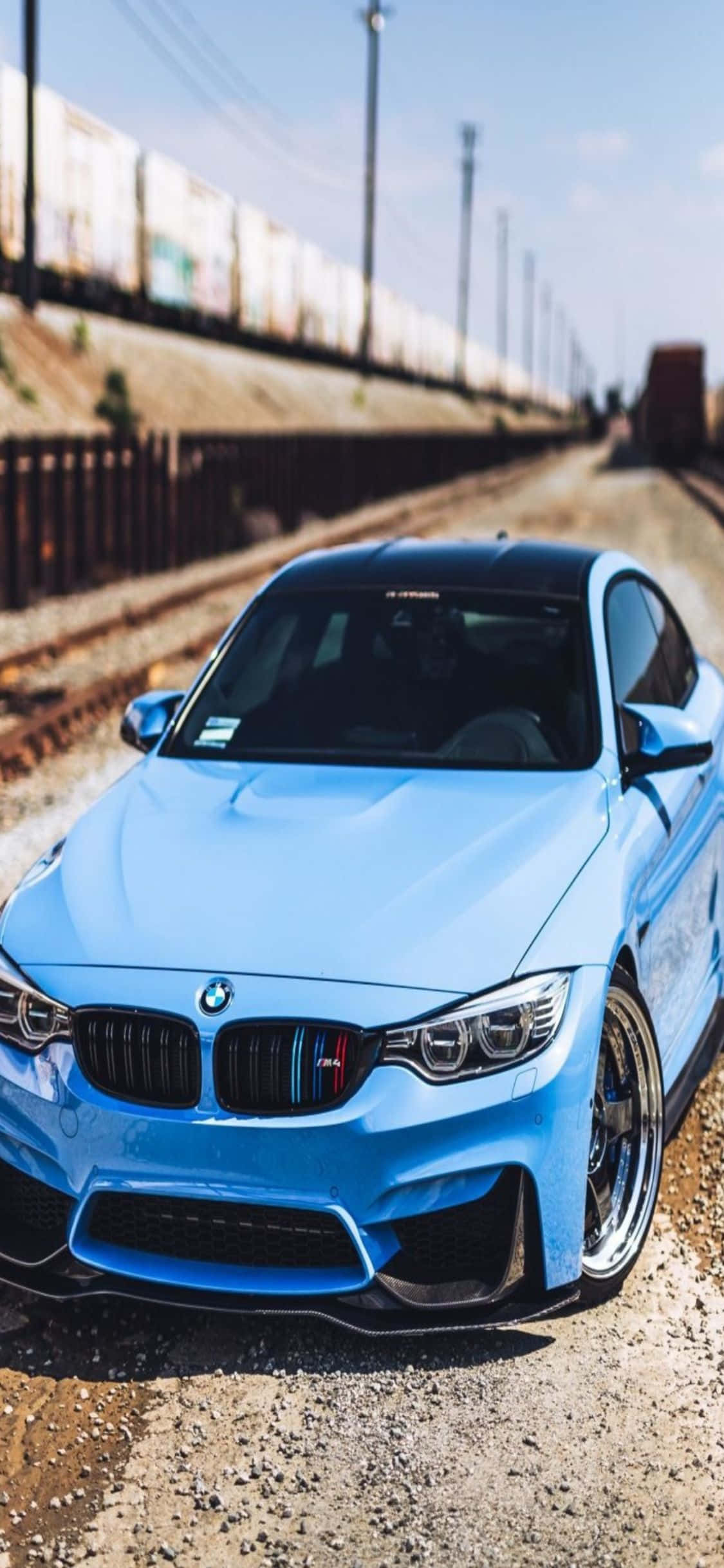 हाई-टेक और शानदार। iPhone X और एक स्लीक BMW एक साथ। वॉलपेपर