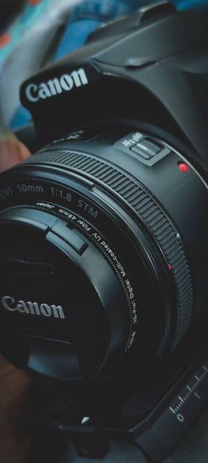 Canon DSLR कैमरा आकृतियाँ — आईफोन 15 वॉलपेपर