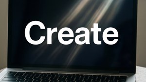 एक न्यूनतम मैकबुक वॉलपेपर जिस पर 'Create' शब्द बोल्ड में लिखा है।